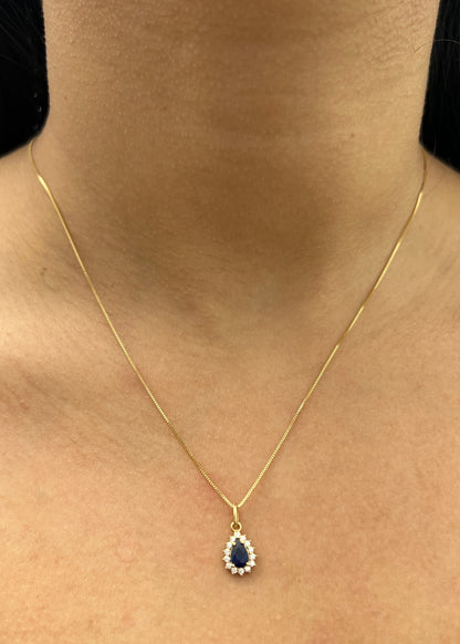 Dije gota con swarovski azul y blanco 0.7gr / Largo 1.5cm / Oro Amarillo Nac B