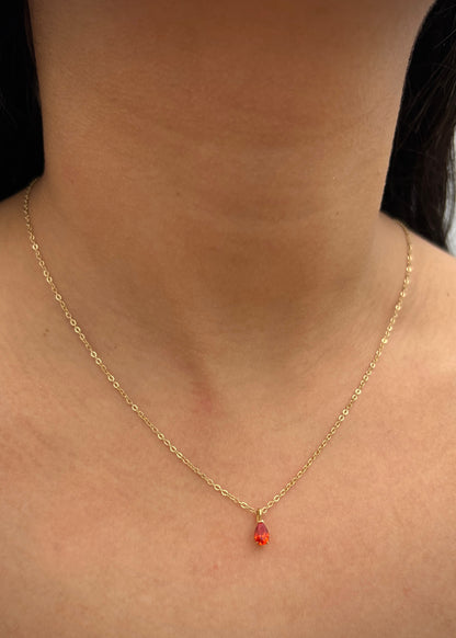 Dije con swarovski naranjado 0.45gr / Largo 0.9cm / Oro Amarillo Nac P