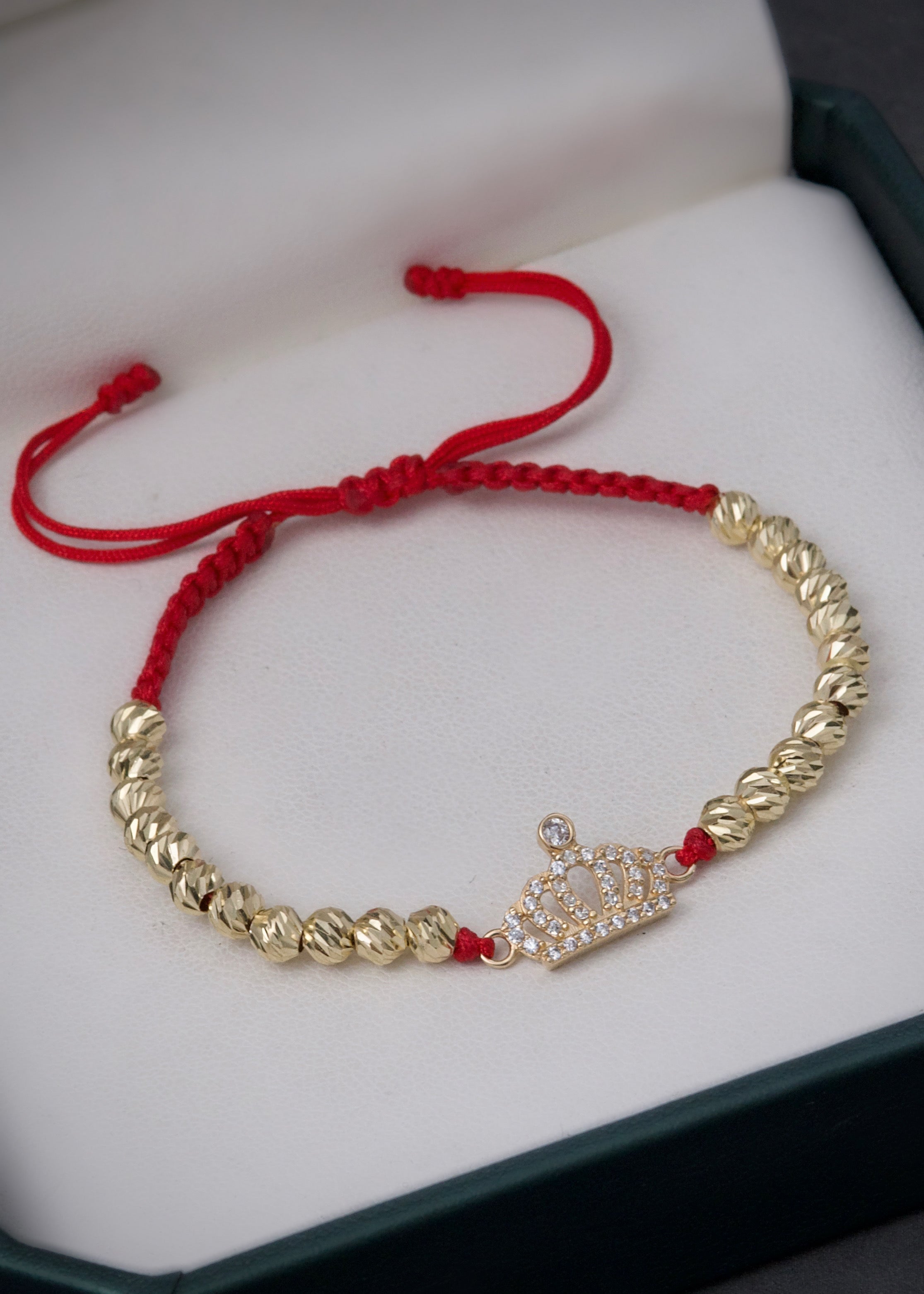 Pulsera en hilo rojo con herraje corona 3.05gr / Oro Amarillo (Joya) M