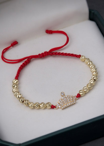 Pulsera en hilo rojo con herraje corona 3.05gr / Oro Amarillo (Joya) M