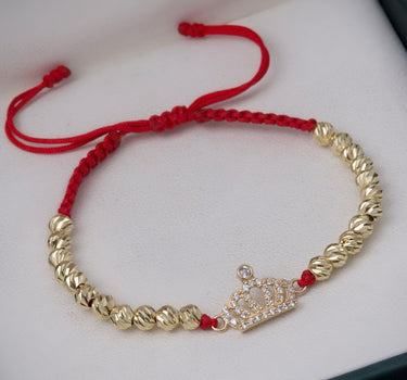 Pulsera en hilo rojo con herraje corona 3.05gr / Oro Amarillo (Joya) M