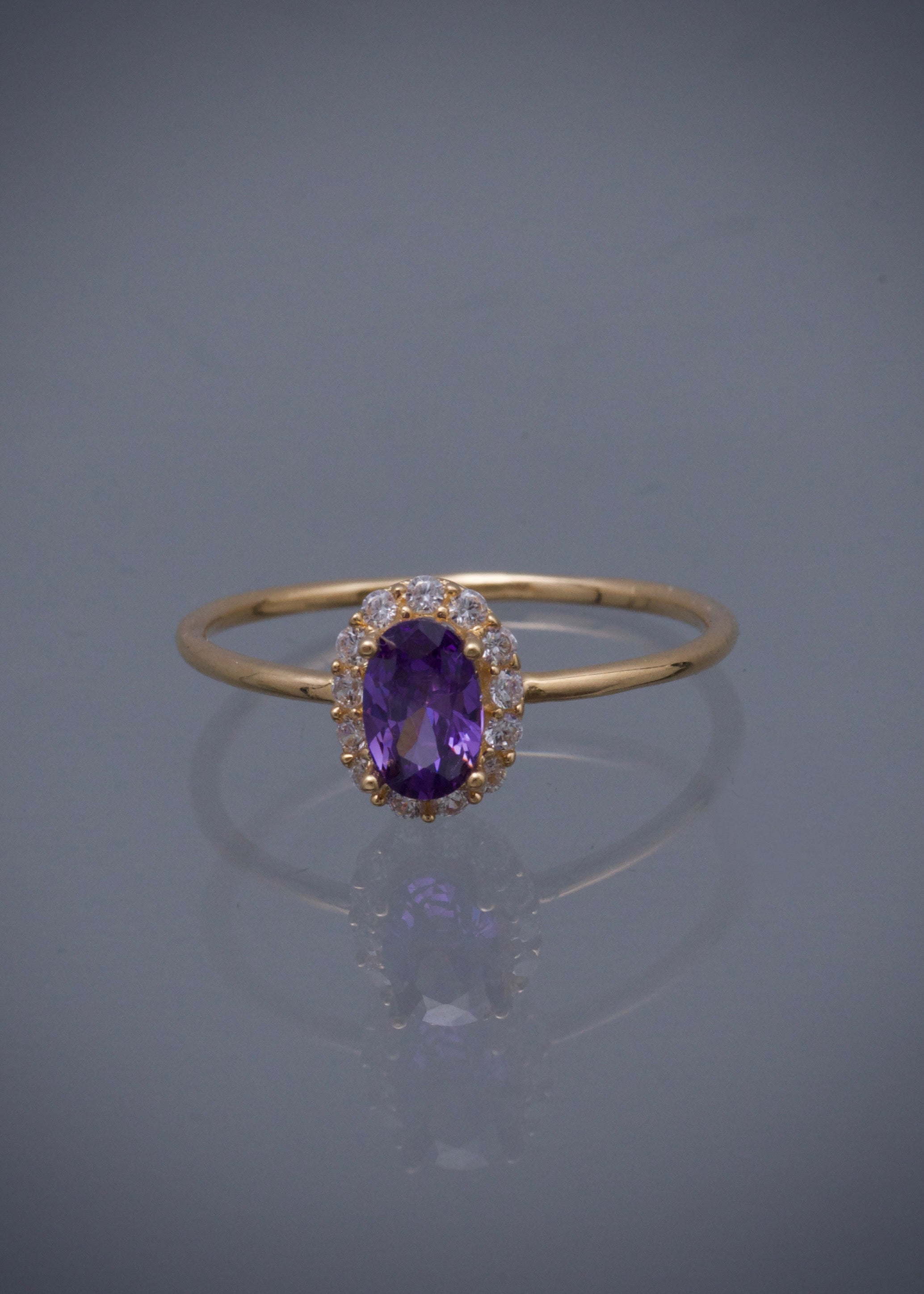 Solitario con swarovski morado y blanco 1.3gr / TALLA 5 1/2 / Oro Amarillo Nac*