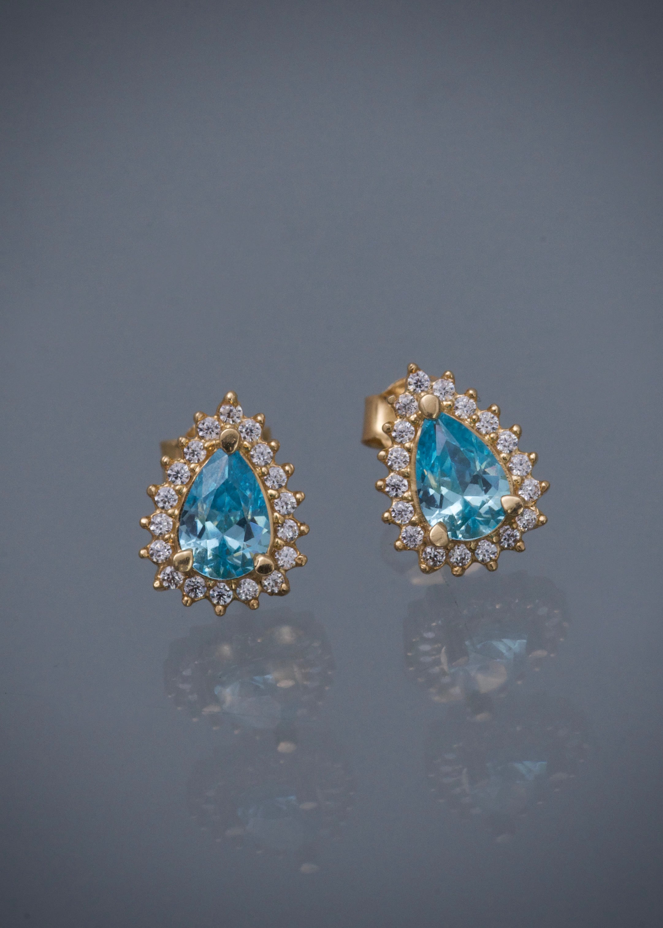 Topos gota con swarovski azul y blanco 2gr / Largo 1cm / Oro Amarillo Nac B