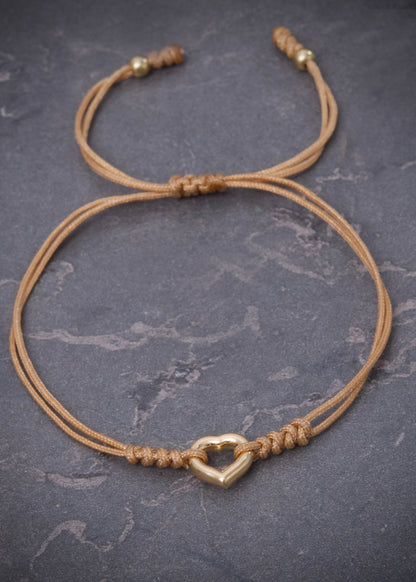 Pulsera hilo beige con herraje corazon 0.4gr / Oro Amarillo (Joya) M