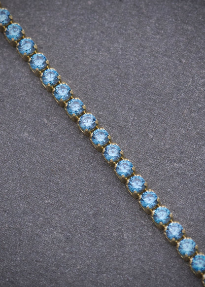 Pulso Tenis con Swarovski Azul 2.7gr / 19cm / 1.8mm — Oro Amarillo