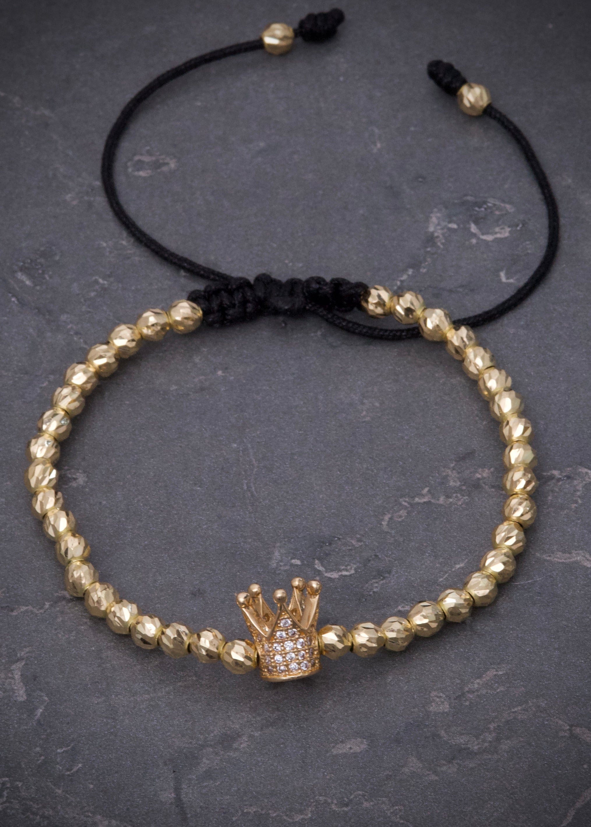 Pulsera en hilo negro con herraje de corona 5.8gr / Oro Amarillo (Joya) M