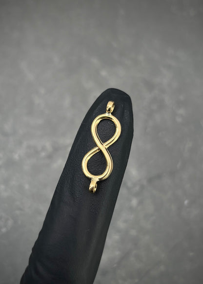 Herraje infinito 0.4gr / Largo 2.3cm / Oro Amarillo Nac B