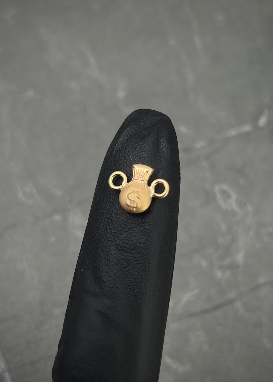 Herraje bolsa de dinero 0.3gr / Largo 1cm / Oro Amarillo Nac B