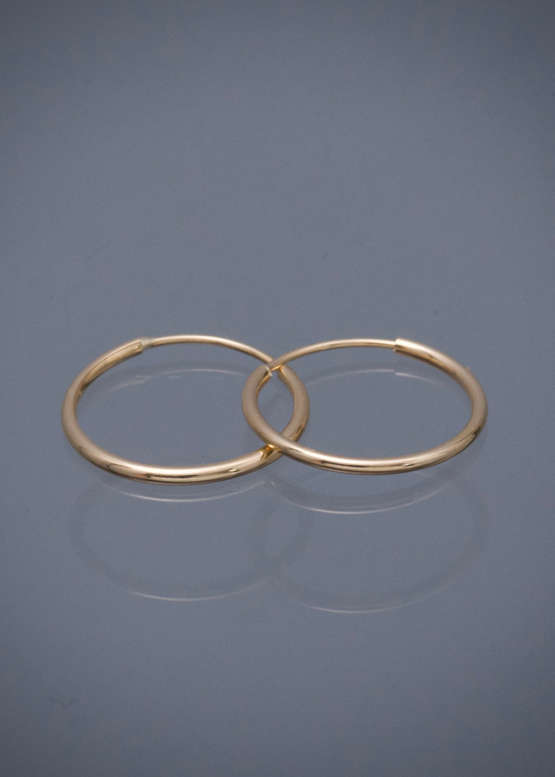 Candongas lisas 0.55gr / Largo 1.2cm — Oro Amarillo