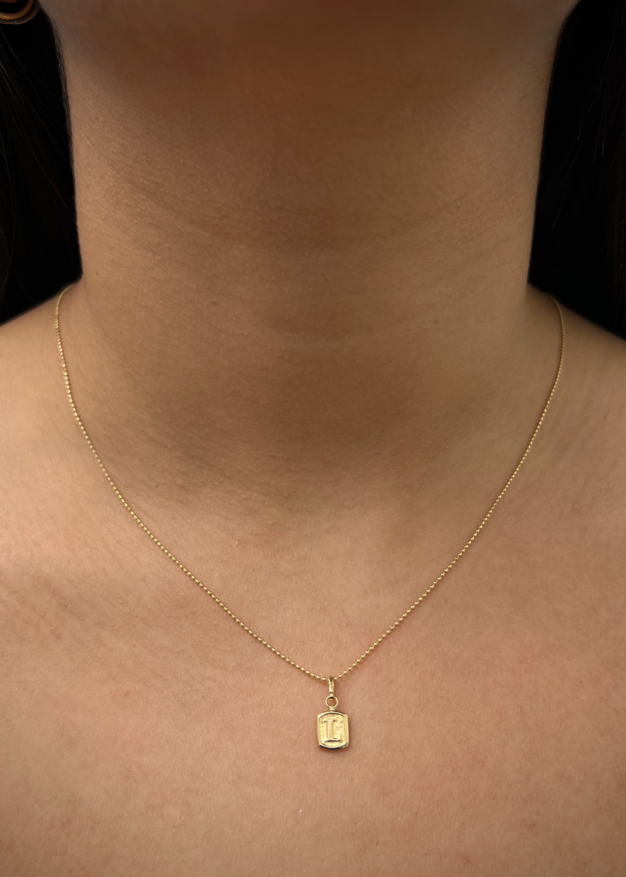 Dije letra L 0.3gr / Largo 1.5cm / Oro Amarillo Nac P