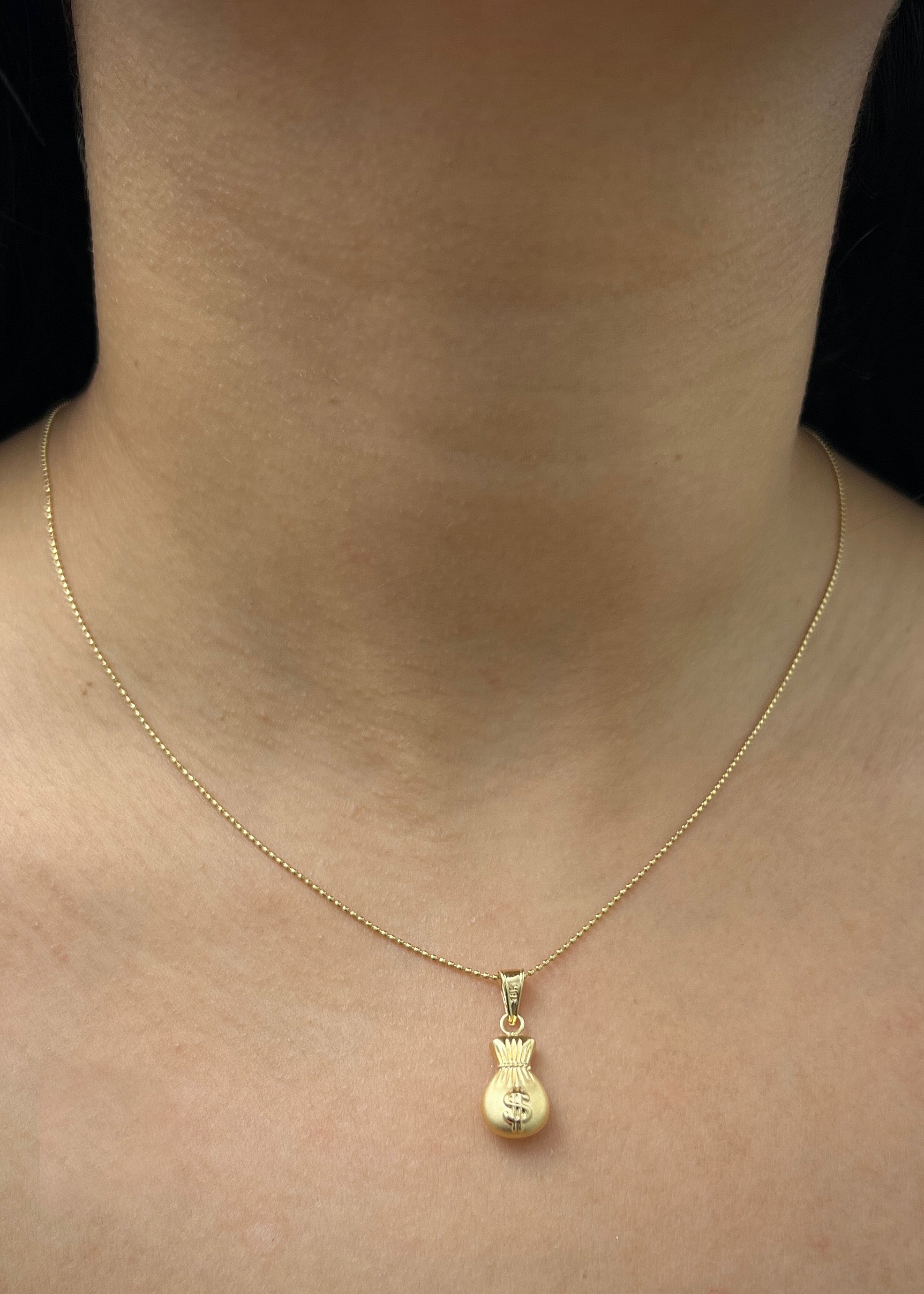 Dije Bolsa de dinero 0.75gr / Largo 2.2cm / Oro Amarillo Nac P