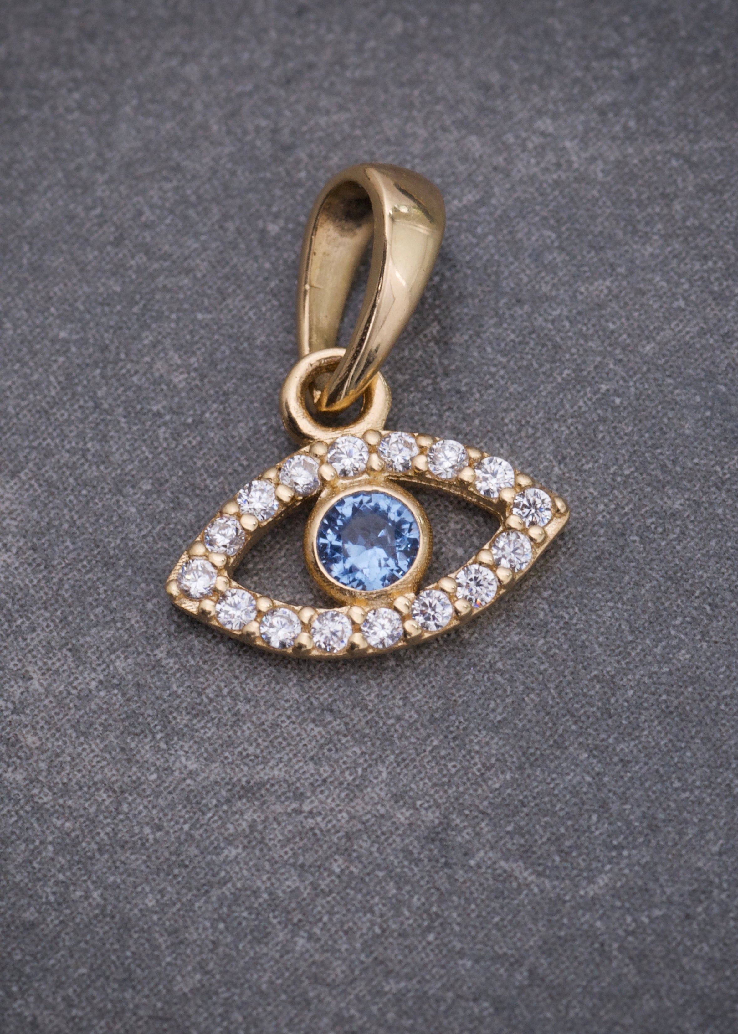 Dije ojo turco con swarovski azul y blanco 0.55gr / Largo 1.2cm / Oro Amarillo Nac B