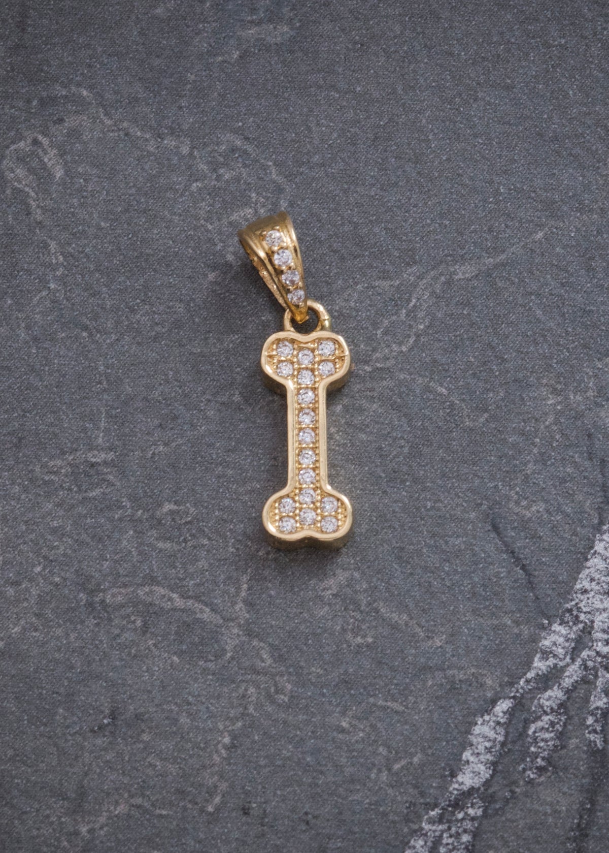 Dije Hueso con Swarovski Blanco 1.15gr / 2cm / 5.4mm — Oro Amarillo