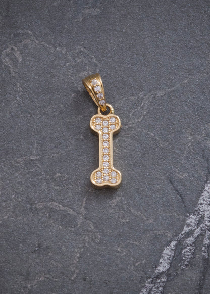 Dije Hueso con Swarovski Blanco 1.15gr / 2cm / 5.4mm — Oro Amarillo