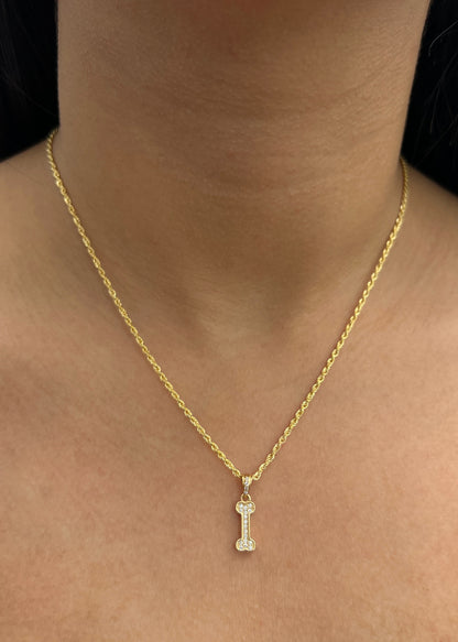 Dije Hueso con Swarovski Blanco 1.15gr / 2cm / 5.4mm — Oro Amarillo