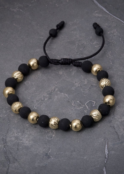 Pulsera en hilo negro con bolas lisas y diamantadas 3.45gr — Oro Amarillo