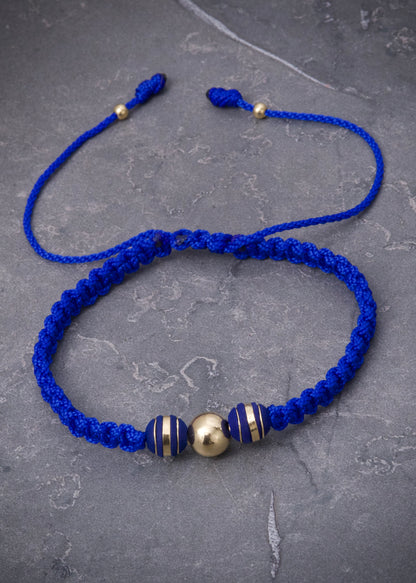 Pulsera en hilo azul con bolas lisas y neoros 0.4gr — Oro Amarillo