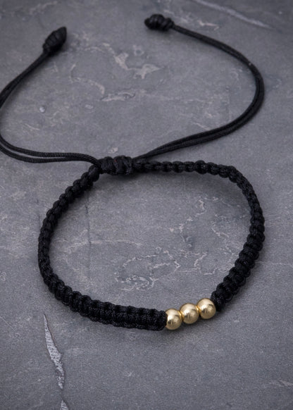 Pulsera en hilo negro con bolas lisas 0.3gr / Oro Amarillo (Joya) M
