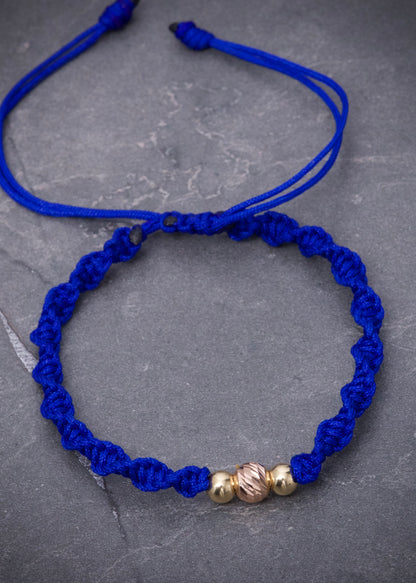 Pulsera En hilo azul con bolas lisas y diamantada 0.35gr / Dos Oros (Joya) M