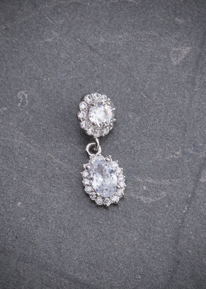 Dije con Swarovskis Blancos 1.1gr / 1.8cm / 6.7mm — Oro Blanco