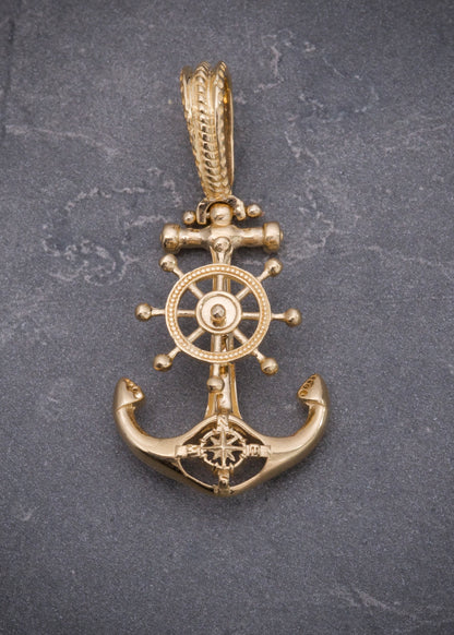 Dije ancla con timon 5.45gr / Largo 3.7cm / Oro Amarillo Nac M