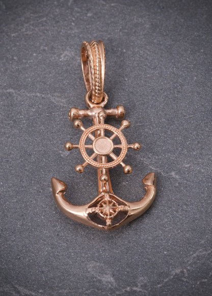 Dije ancla con timon 2.3gr / Largo 2.8cm / Oro Rosado Nac M