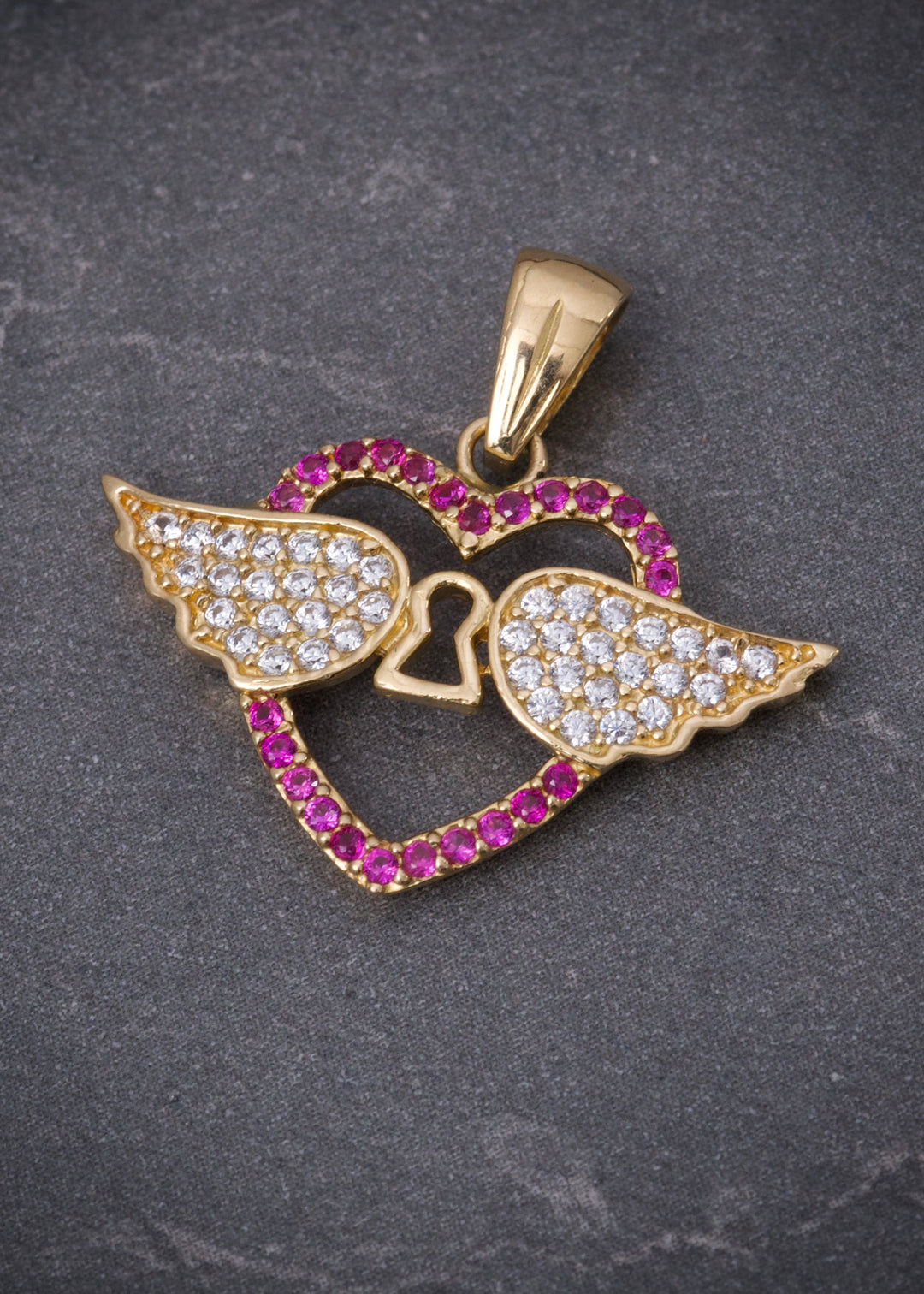 Dije corazon con alas 2.4gr / Largo 2.1cm — Oro Amarillo
