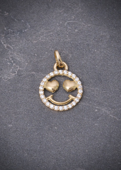Dije cara feliz con swarovski blanco 0.9gr / Largo 1.8cm / Oro Amarillo Nac*