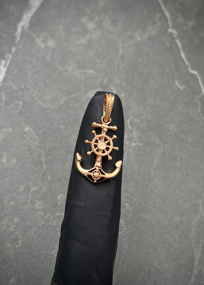 Dije ancla con timon 2.3gr / Largo 2.8cm / Oro Rosado Nac M