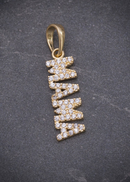 Dije mamá con swarovski blanco 1.1gr / Largo 2.5cm / Oro Amarillo Nac M