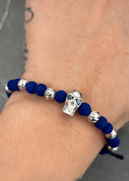 Pulsera en hilo azul con herraje calavera 4.58gr / Oro Blanco (Joya) M