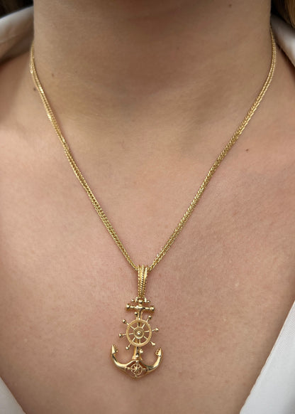 Dije ancla con timon 5.45gr / Largo 3.7cm / Oro Amarillo Nac M