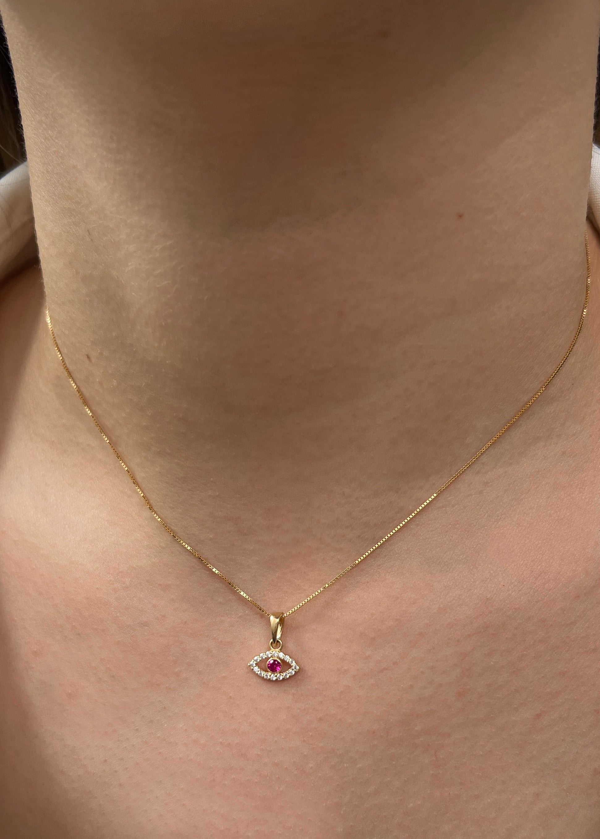 Dije ojo turco con swarovski fucsia y blanco 0.6gr / Largo 1.2cm / Oro Amarillo Nac*