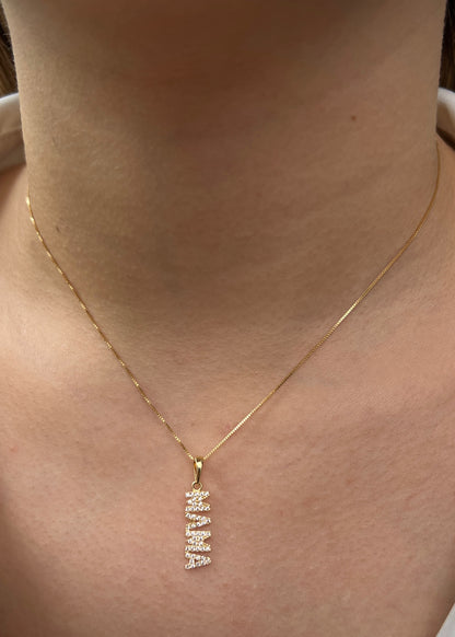 Dije mamá con swarovski blanco 1.1gr / Largo 2.5cm / Oro Amarillo Nac M