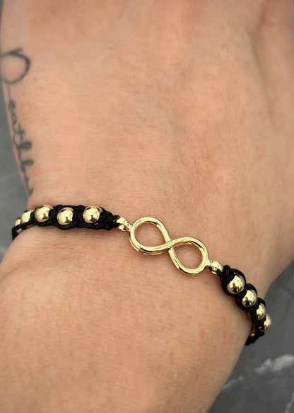 Pulsera en hilo negro con herraje de infinito 1.33gr / Oro Amarillo (Joya) M