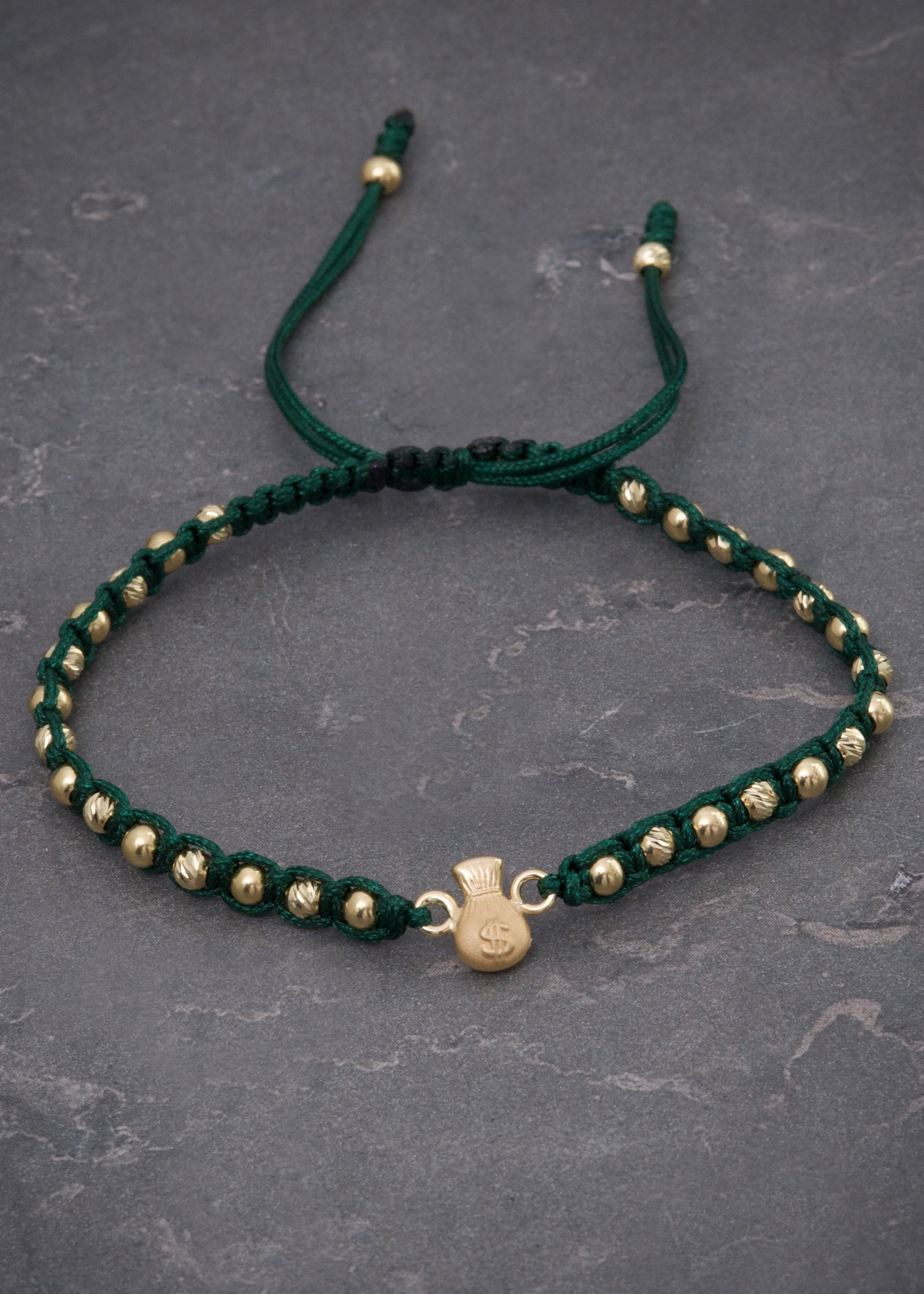 Pulsera en hilo verde con herraje bolsa de dinero 1.61gr / Oro Amarillo (Joya) M