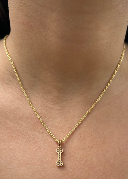 Dije Hueso con Swarovski Cafe 1.15gr / 1.9cm / 5.4mm — Oro Amarillo