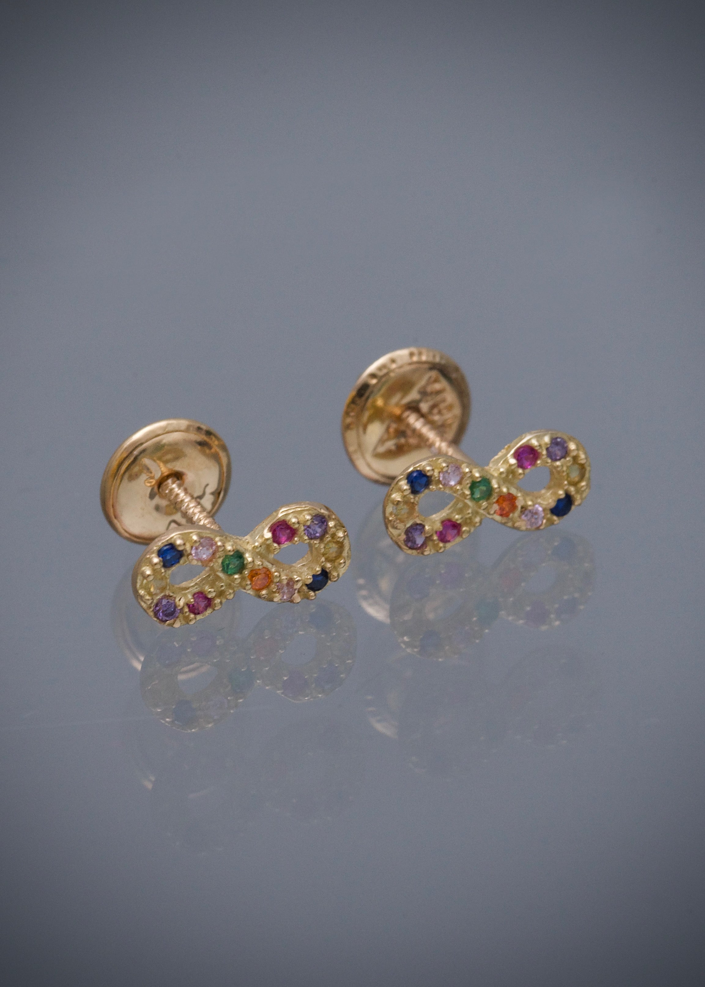 Topos infinito con swarovski multicolor 0.9gr / Largo 0.4cm / Oro Amarillo Nac B