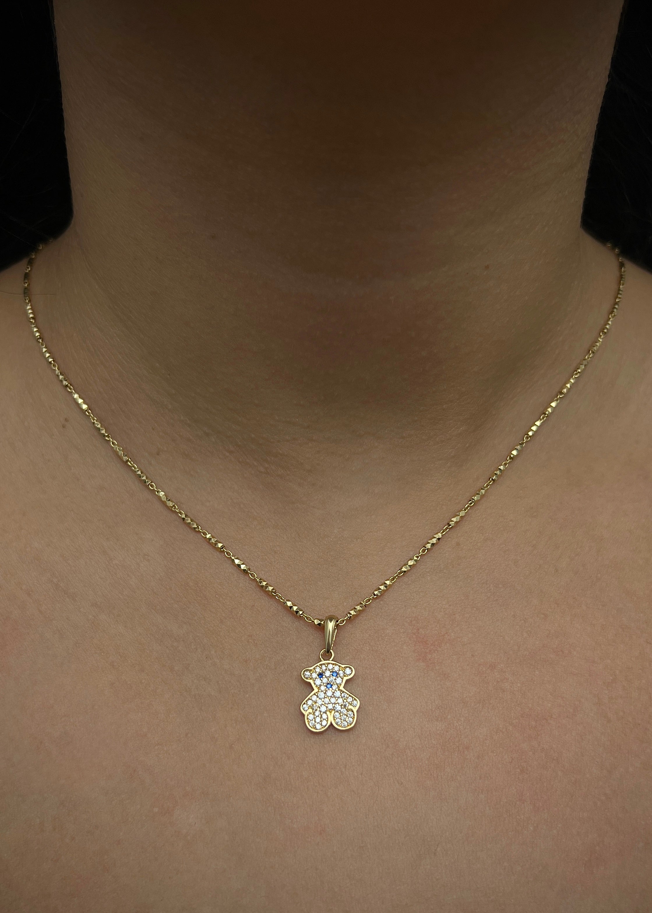 Dije oso th con swarovski blanco y azul 1.6gr / Largo 2.1cm / Oro Amarillo Nac M