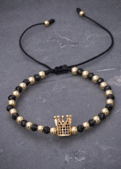 Pulsera en hilo negro con herraje corona 3.45gr / Oro Amarillo (Joya) M