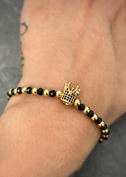 Pulsera en hilo negro con herraje corona 3.45gr / Oro Amarillo (Joya) M
