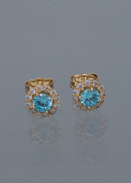 Topos flor con swarovski azul y blanco 3.1gr / Largo 0.9cm / Oro Amarillo Nac M