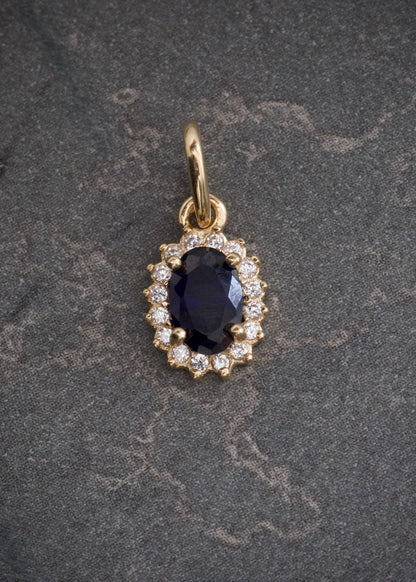 Dije ovalado con swarovski azul y blanco 0.6gr / Largo 1.4cm / Oro Amarillo Nac M