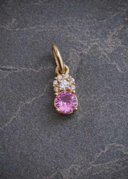 Dije con swarovski rosado y blanco 0.6gr / Largo 1.3cm / Oro Amarillo Nac M