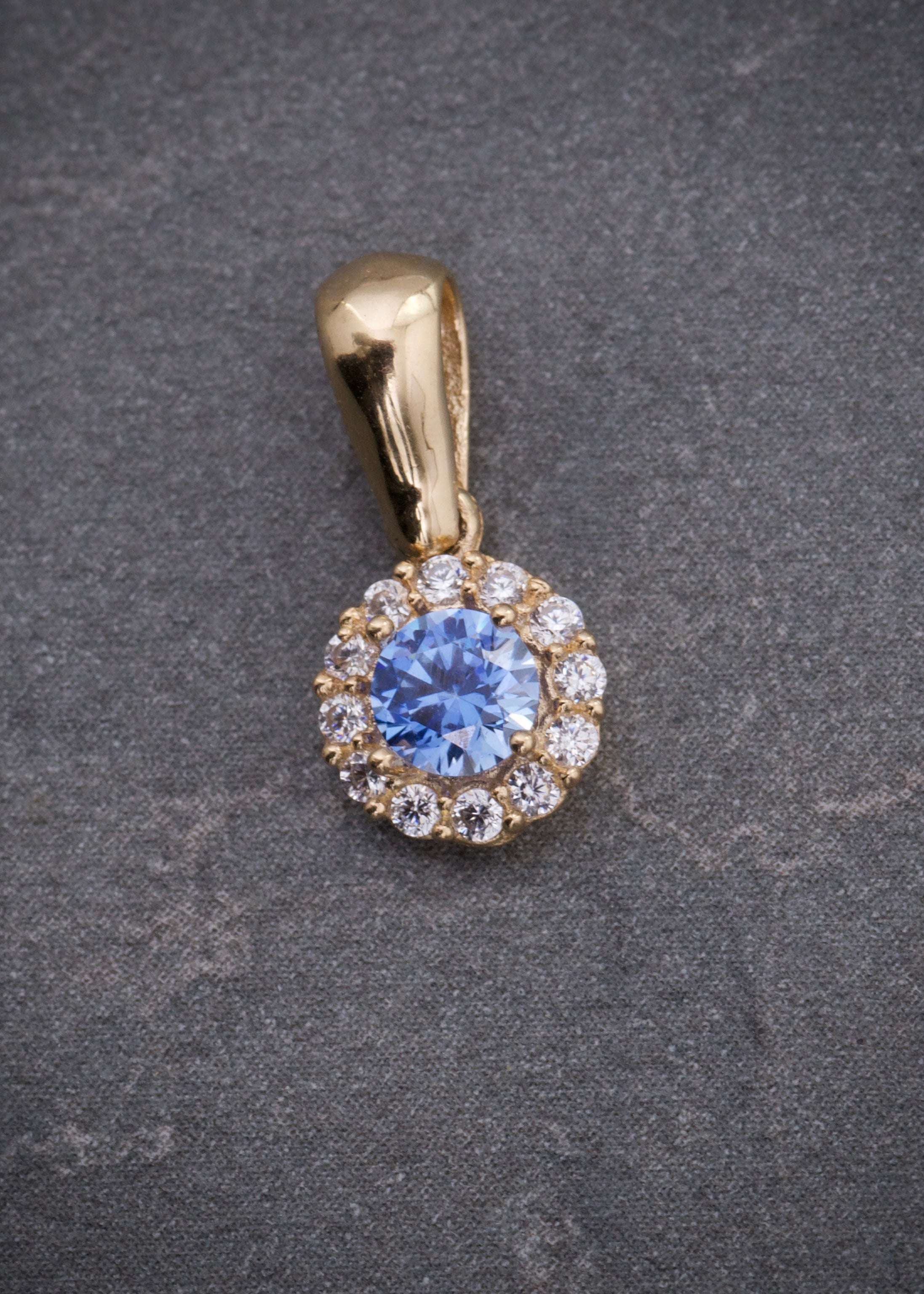 Dije flor con swarovski azul y blanco 0.95gr / Largo 1.4cm / Oro Amarillo Nac P