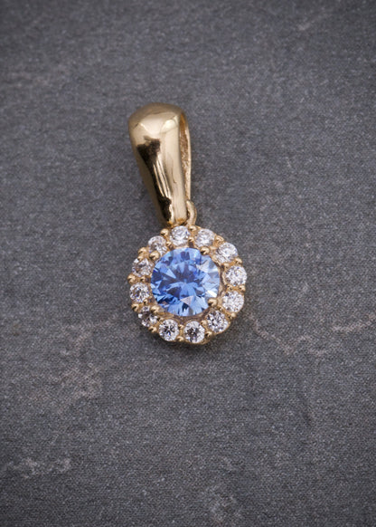 Dije flor con swarovski azul y blanco 0.95gr / Largo 1.4cm / Oro Amarillo Nac P