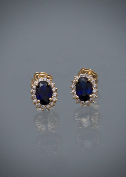 Topos ovalado con swarovski azul y blanco 1.4gr / Largo 0.8cm / Oro Amarillo Nac M