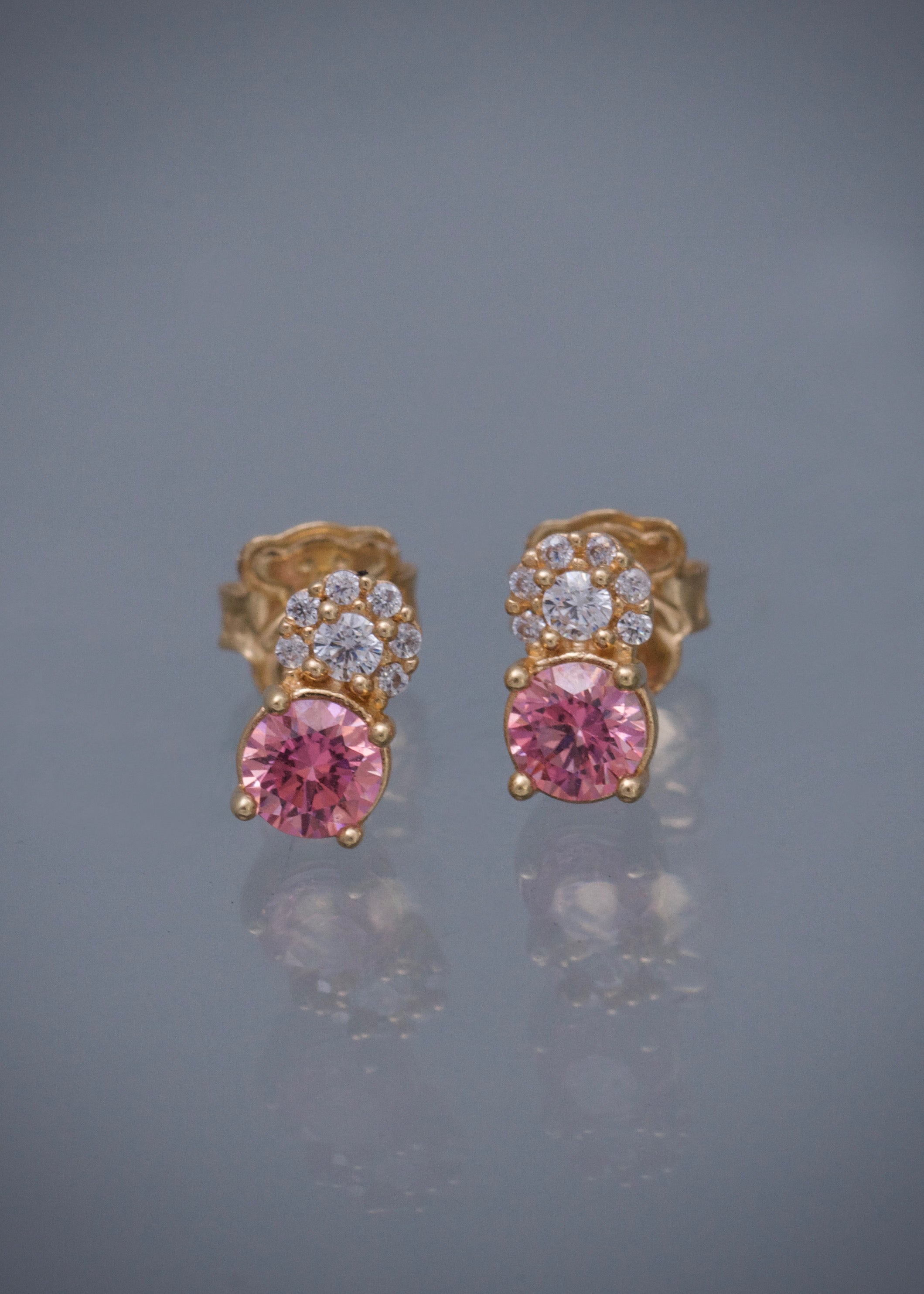 Topos con swarovski rosado y blanco 1.6gr / Largo 0.7cm / Oro Amarillo Nac P