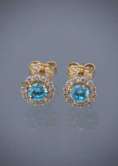 Topos flor con swarovski azul y blanco 2.2gr / Largo 0.7cm / Oro Amarillo Nac M