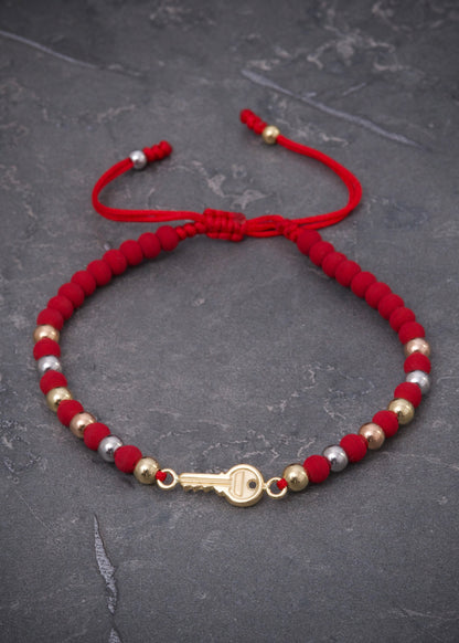 Pulsera en hilo rojo con herraje llave 1.55gr / Tres Oros (Joya) P